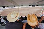 Spectators wathcing a rodeo event at the Calgary Stampede, Canada