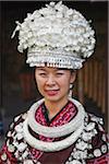 Woman dressed in traditional clothing of Yao minority at Folk Culture Village, Shenzhen, Guangdong, China