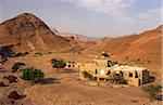 Jordan, Dana Biosphere Reserve, Wadi Feynan. The remote Feynan Eco-lodge stands amidst desert scenery near the confluence of Wadi Feynan and Wadi Araba.