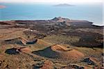 The lava barrier that separates the southern end of Lake Turkana from the Suguta Valley. South Island is in the distance while the extinct volcanic crater, Abil Agituk, is close to the lakeshore. The region is pockmarked with volcanic cones.