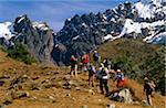 Peru, Andes, Cordillera Vilcabamba, Salkantay (or Salcantay) Trail. Trekkers head towards a small glacier lake at the foot of 5660m high Nevado Tucarhuay near Soraypampa.