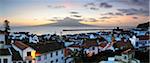 The city of Horta at dawn with the volcano of Pico island on the horizon. Faial, Azores islands, Portugal