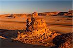 Saudi Arabia, Madinah, nr. Al-Ula. Rocky stacks and bluffs dot the stark landscapes on the edge of the Nefud (aka Nafud) Desert.