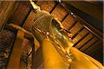 Thailand, Bangkok.  Reclining Buddha statue at Wat Pho.