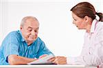 Man and Woman Discussing Paperwork