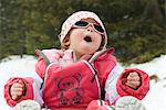 Toddler girl having fun in snow