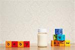 Baby milk and alphabet blocks