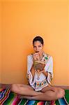 Woman drinking tropical fruit juice