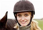 Portrait of a woman wearing a riding helmet, Sweden.