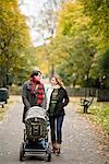 A couple taking a walk with their son, Sweden.