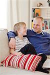 Father and son in a couch, Sweden.