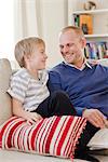 Father and son in a couch, Sweden.