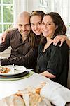 Portrait of a family at a dinner table, Sweden.