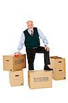 Senior man carrying boxes.