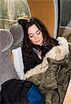 A woman sleeping on a train, Sweden.