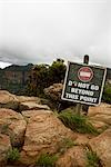 Warning sign by a canyon, South Africa.