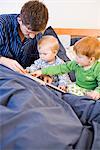 A family in a bed, Sweden.