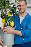 Man with a lemon tree.