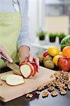 Woman making a fruit salad, Sweden.