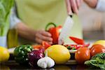 Woman cutting up vegetables, Sweden.