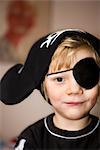 Small boy dressed as pirate