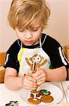 Boy preparing cookies