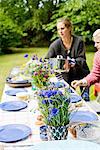 Women preparing dining table