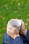 Woman holding coffee cup