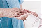 Close-up of Caregiver holding Patient's Hand