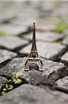 Miniature Eiffel Tower on Cobblestone Street