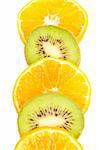 Oranges and kiwis slices closeup over a white background