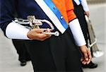 Close-up of a band member holding a trumpet.