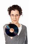 Business woman holding a dvd disc over a white background. Focus on dvd disc
