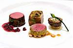 Seared Australian loin of lamb, shiraz reduction with pomegranate, braised shank and thyme, eggplant zucchini and tomato baked mousaka, artichoke and feta bake with wild garlic chives