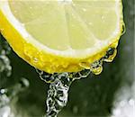 Water dripping off a lemon slice