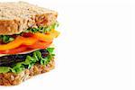 Big healthy sandwich with vegetables and meat close up on white background with copy space