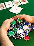 Poker player raking a big pile of chips