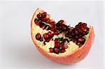 Pomegrantes ripped open with seeds exposed