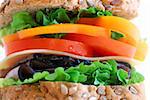 Big healthy sandwich with vegetables and meat close up