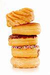 Tower of assorted donuts isolated on white background