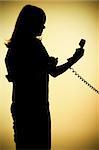 isolated on gold silhouette of woman on the phone