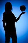 isolated on blue silhouette of woman with globe