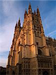 Canterbury Cathedral at sunset against a blue sky