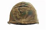 A military helmet of camouflage on white background. Shallow DOF