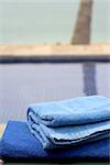 Blue towels by the beach and swimming pool. Concept: vacation.