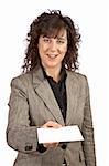 Business woman handing a blank card over a white background. Selective focus on card