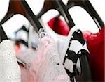 Women's clothing on a rack on black hangers