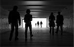 People silhouettes in a subway tunnel