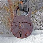 Old and rusty padlock locked safe security