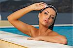 Beautiful young Sexy brunette woman in swimming pool